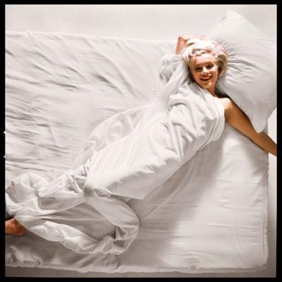 Marilyn Monroe poses naked in bed for photographer Douglas Kirkland in Los Angeles, 1961